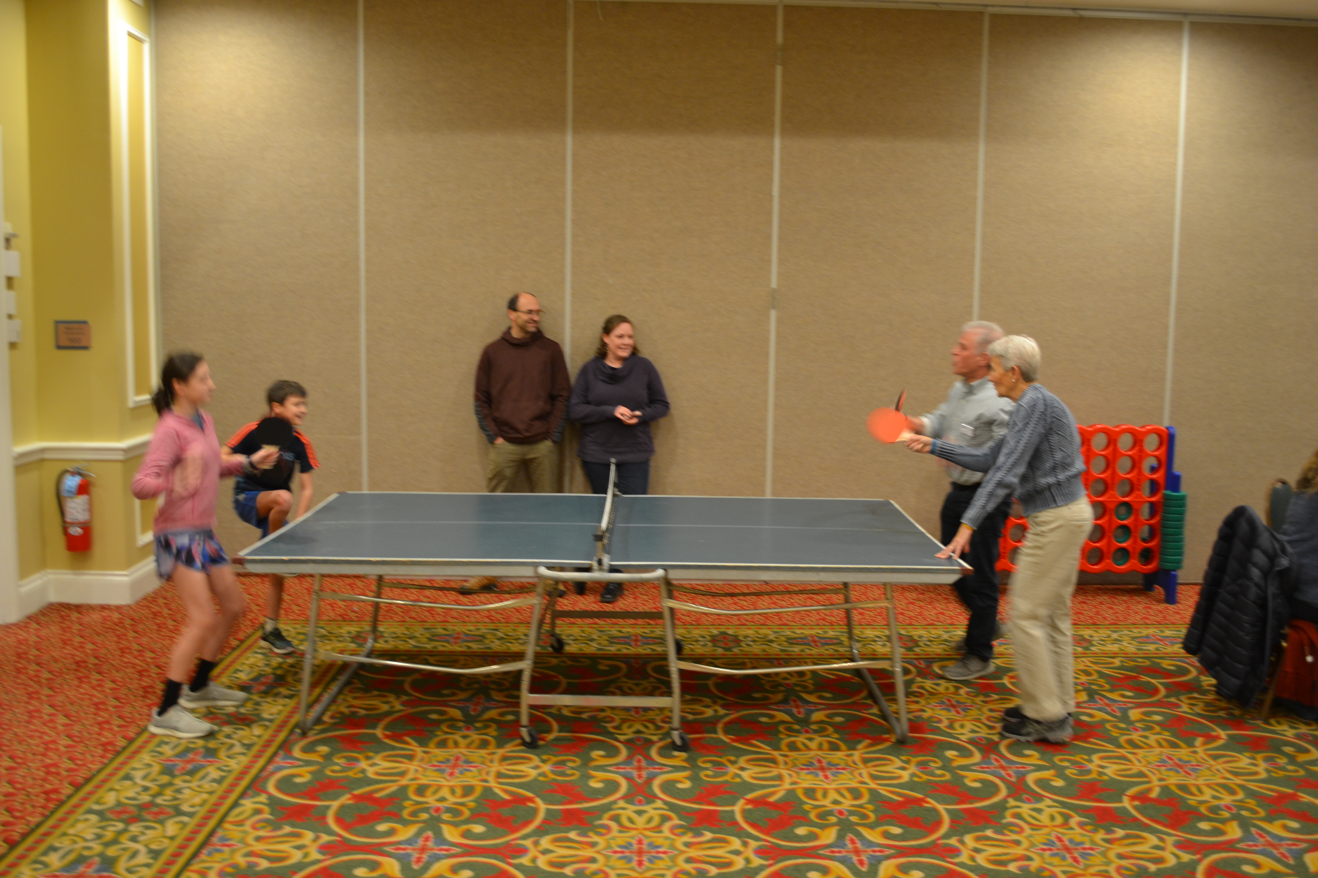 Drs. Youth and Talbot taking on the kids in ping pong!