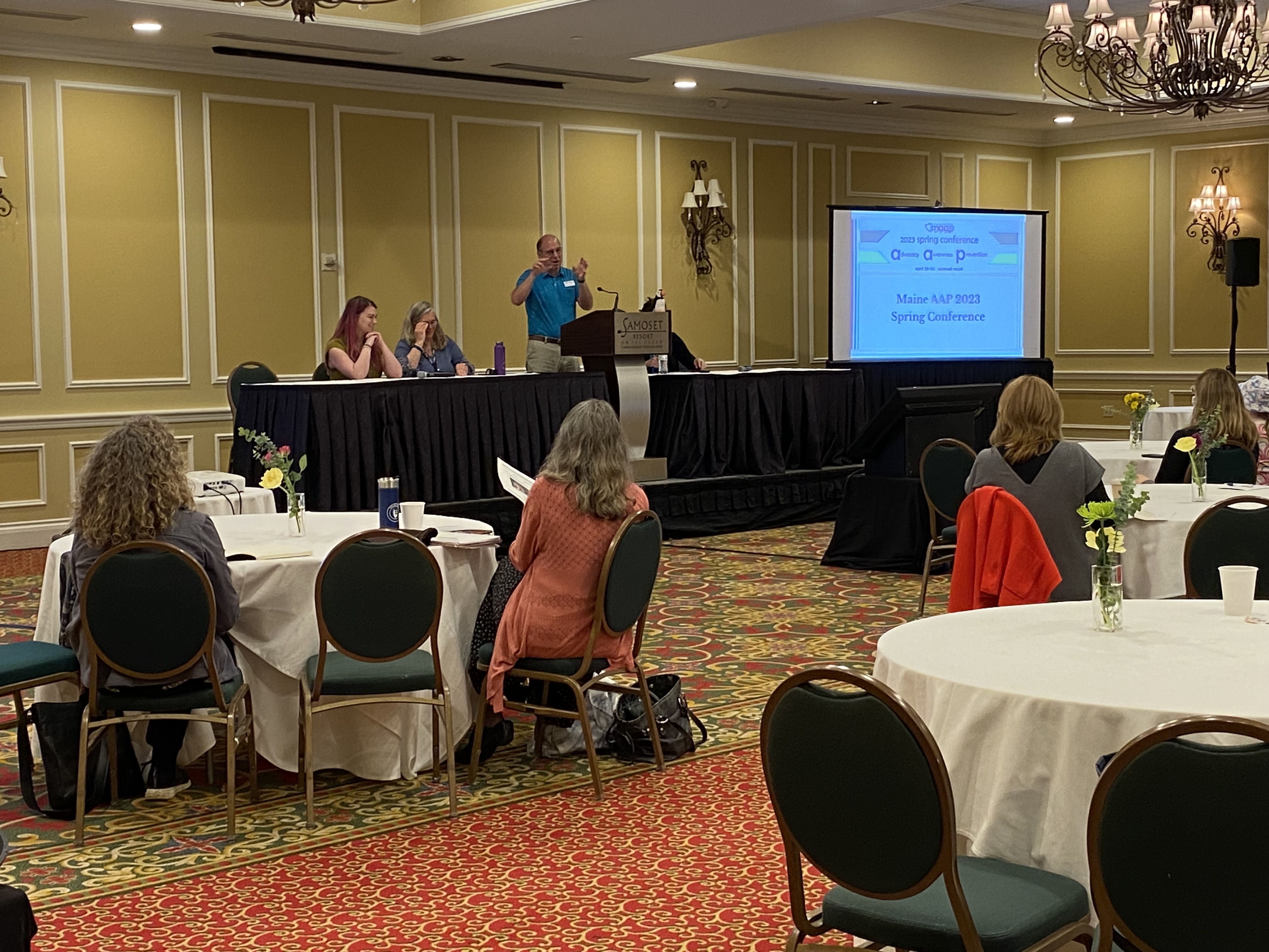 Jeff Stone introducing the Oral Health Panel speakers, Courtney, Becca and Dr. Williams